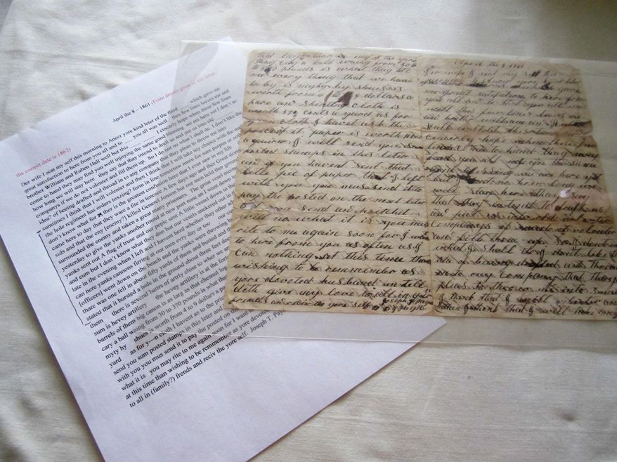 ADVANCE FOR MONDAY FEB. 24 AND THEREAFTER - This Sunday Feb. 16, 2014 photo shows a recently-donated collection of letter and its transcription written by a Civil War soldier from Pittsylvania County to his wife, at the museum in Danville, Va. The elaborate script and often-misspelled words of Pvt. Joseph Payne’s letters home to his wife have made transcribing them a challenge. (AP Photo/The Register & Bee, Denice Thibodeau)