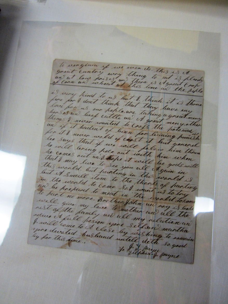 ADVANCE FOR MONDAY FEB. 24 AND THEREAFTER - This Sunday Feb. 16, 2014 photo shows a recently-donated collection of letters written by a Civil War soldier from Pittsylvania County to his wife, at the museum in Danville, Va. The elaborate script and often-misspelled words of Pvt. Joseph Payne’s letters home to his wife have made transcribing them a challenge. (AP Photo/The Register & Bee, Denice Thibodeau)