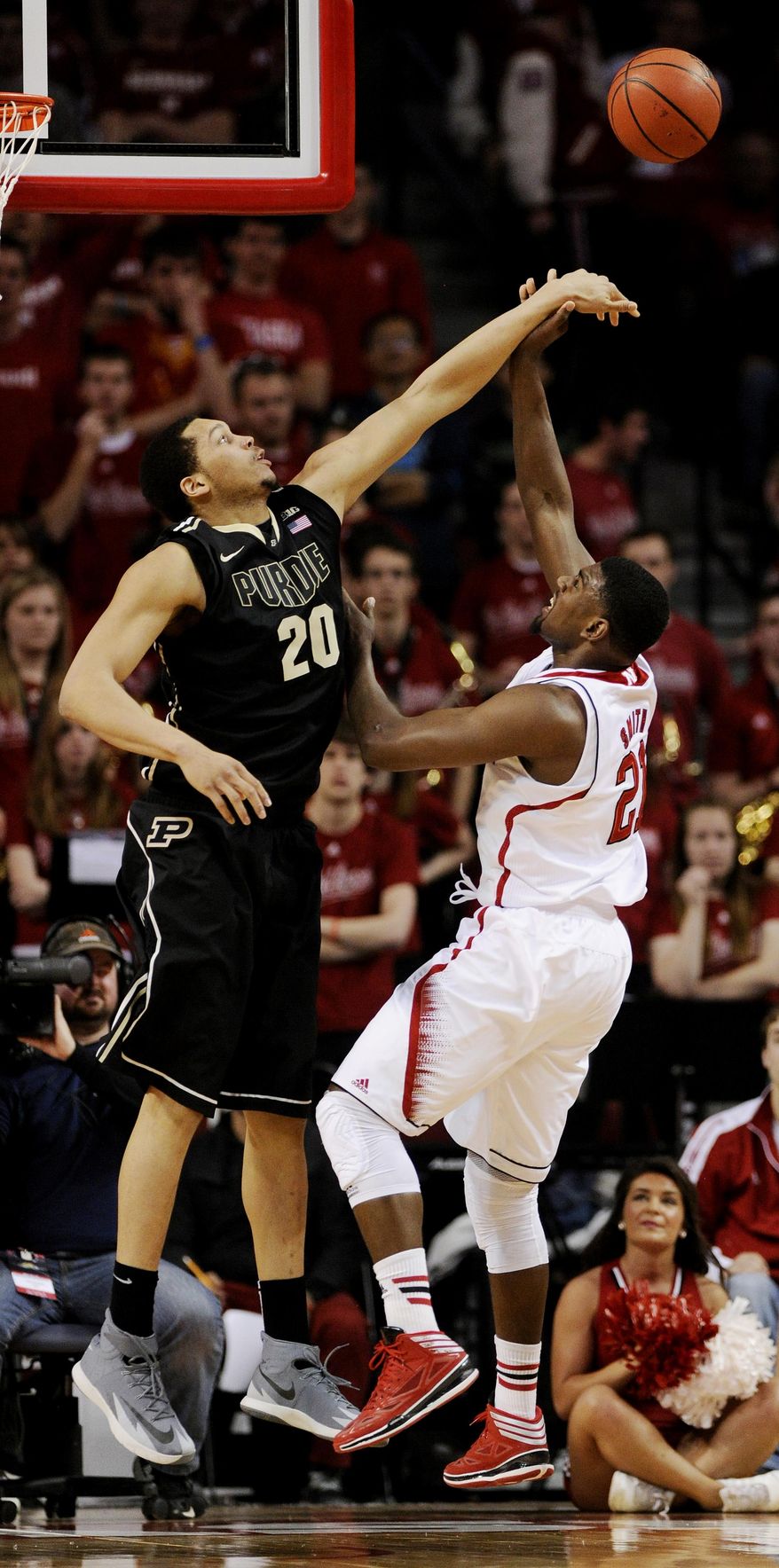 Purdue center A. J. Hammons (20) blocks the shot of Nebraska forward Leslee Smith (21) during the first half of an NCAA college basketball game in Lincoln, Neb., on Sunday, Feb. 23, 2014. (AP Photo/Francis Gardler)