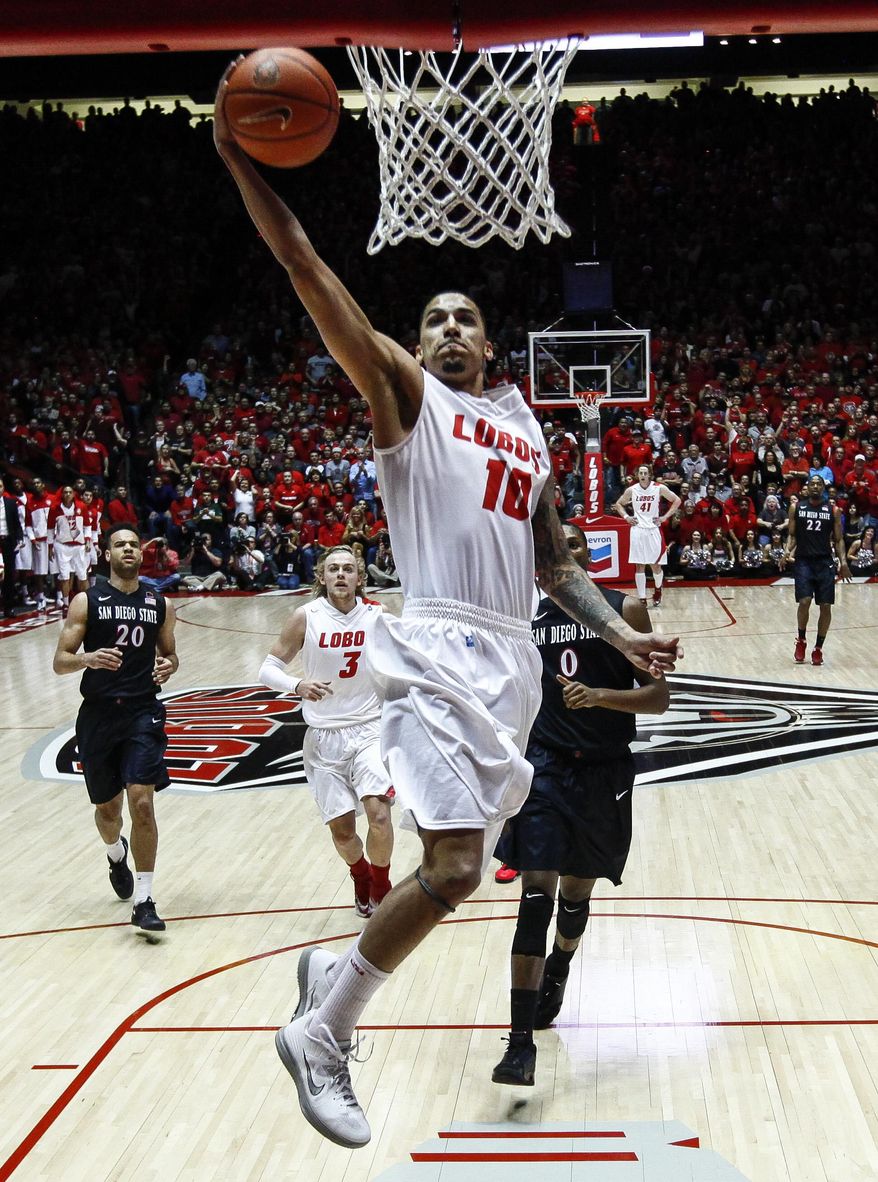 New Mexico's Kendall Williams (10) scores on a breakaway during the first half of an NCAA college basketball game against San Diego State at The Pit in Albuquerque, N.M., Saturday, Feb. 22, 2014. (AP Photo/Juan Antonio Labreche)