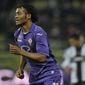 Fiorentina&#x27;s Guillermo Cuadrado of Colombia celebrates after scoring a goal during their Serie A soccer match against Parma, at Parma&#x27;s Tardini stadium, Italy, Monday, Feb. 24, 2014. (AP Photo/Marco Vasini)