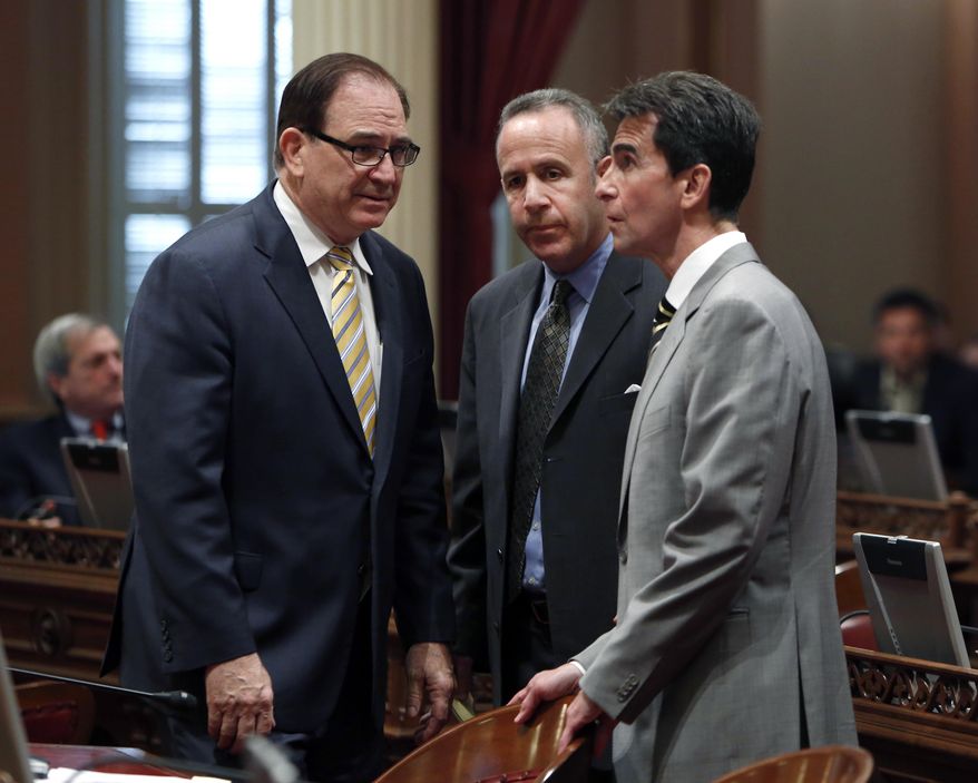 Senate Minority Leader Bob Huff, R-Diamond Bar, left, huddles with Senate President Pro Tem Darrell Steinberg, D-Sacramento, center and Sen. Mark Leno, D-San Francisco, at the Capitol in Sacramento, Calif., Monday, Feb. 24, 2014. After a closed door meeting, Senate Democrats said they will give state Sen. Ron Calderon, D-Montebello, one week to resign or take an indefinite leave of absence. If he does not, the Senate will move to suspend him. Calderon pleaded not guilty Monday to federal corruption charges involving bribes, kickbacks and fraud. (AP Photo/Rich Pedroncelli)