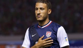 FILE - In this Sept. 6, 2013, file photo, United States&#x27; Fabian Johnson stands prior to a 2014 World Cup qualifying soccer match against Costa Rica in San Jose, Costa Rica. Borussia Moenchengladbach has signed U. S. midfielder Fabian Johnson from Bundesliga rival Hoffenheim as of next season. (AP Photo/Moises Castillo, File)