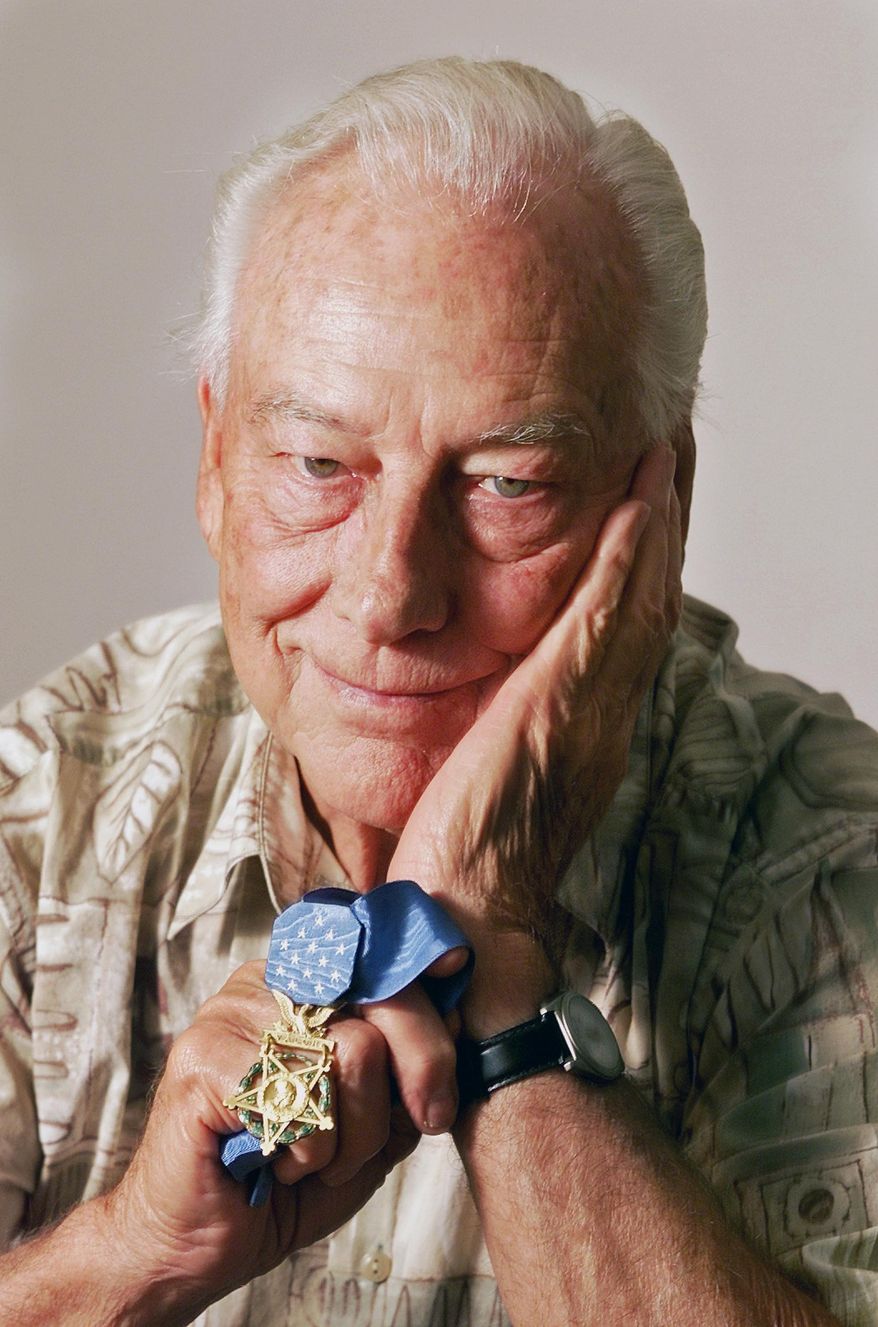 FILE - This 2001 file photo shows Walt Ehlers, of Buena Park, Calif., a recipient of The Medal of Honor in Buena Park. Ehlers accomplished some of the most awe-inspiring acts of bravery imaginable during the historic D-Day invasion of World War II, earning him the medal for knocking out two German machine-gun nests and saving countless Allied soldiers' lives. He died Thursday, Feb. 20, 2014, at a Long Beach hospital of kidney failure, his wife, Dorothy, told The Associated Press on Monday. He was 92, and his passing leaves only seven surviving World War II Medal of Honor recipients. (AP Photo/The Orange County Register, Jebb Harris, File) MAGAZINES OUT; LOS ANGELES TIMES OUT.