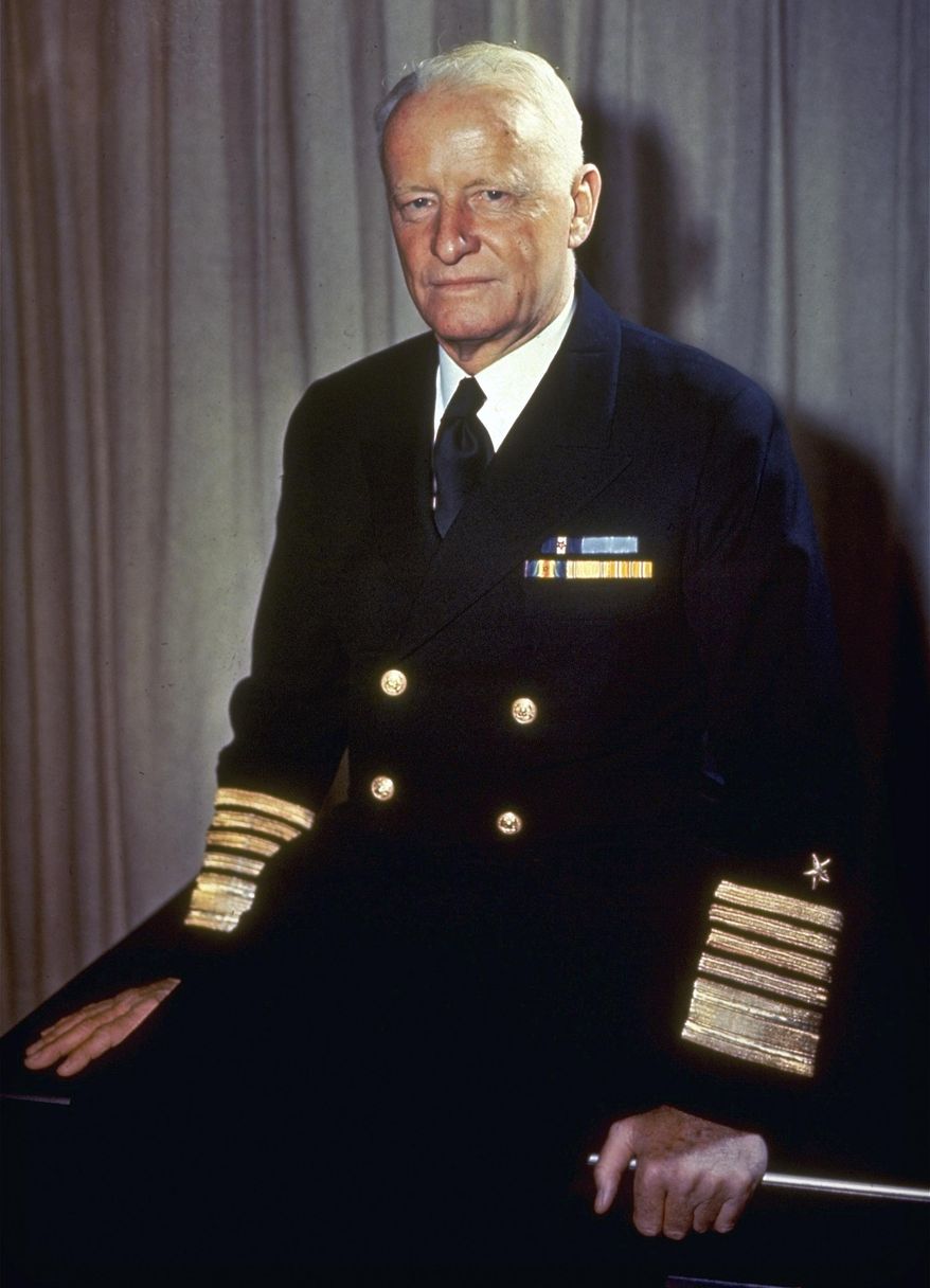 FILE - This undated file photo shows Adm. Chester W. Nimitz, commander of U.S. Naval forces in the Pacific during World War II, sitting on a desk in an unknown location. The U.S. Naval War College in Newport, R.I., released a trove of World War II information by posting online Monday, Feb. 24, 2014, the operational diary kept by Adm. Nimitz during the war against Japan. The more than 4,000 pages includes a running estimate of the situation for every day of the war in the Pacific compiled by Nimitz's planning staff, starting with the day Japan attacked Pearl Harbor. (AP Photo, File)