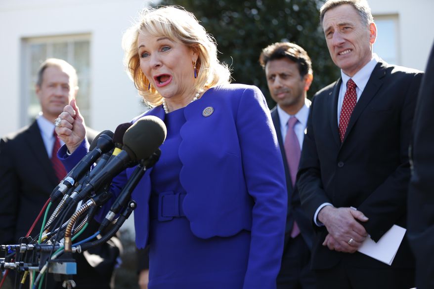 National Governors Association (NGA) Chair Oklahoma Gov. Mary Fallin, center, speaks to reporters outside the White House in Washington, Monday, Feb. 24, 2014, following a meeting between President Barack Obama and members of the NGA. From left are, Maryland Gov. Martin O'Malley, Fallin, Louisiana Gov. Bobby Jindal, and Vermont Gov. Peter Shumlin. (AP Photo/Charles Dharapak)