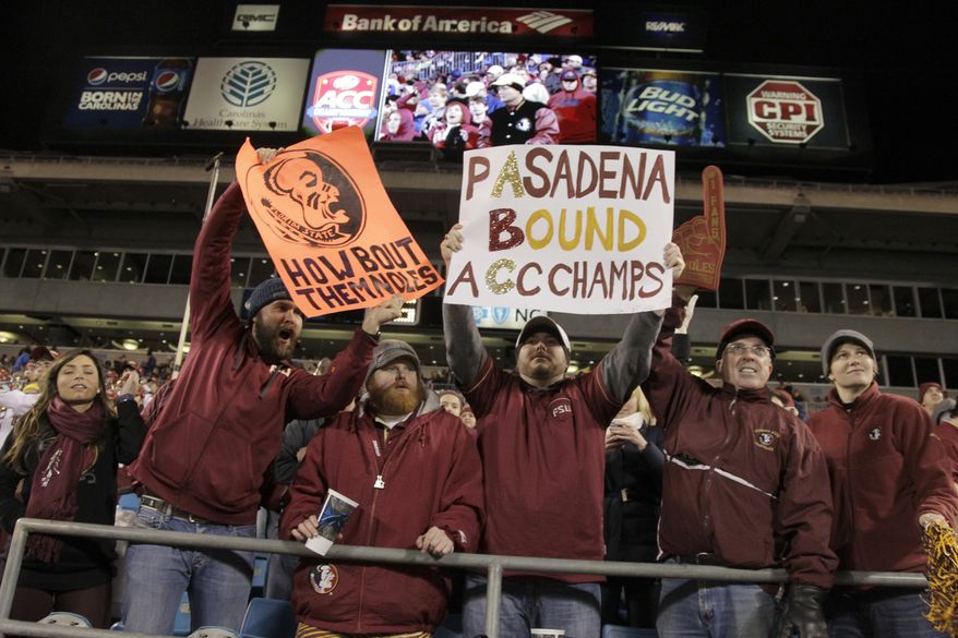 Florida State fans celebrate in the second half of the Atlantic Coast Conference Championship NCAA football game against Duke in Charlotte, N.C., Saturday, Dec. 7, 2013. (AP Photo/Bob Leverone)
