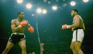 Sonny Liston, in black trunks, is seen just before Muhammad Ali&#39;s &quot;phantom punch&quot; that knocked him out in 1 minute, 42 seconds of the first round during their heavyweight championship bout in Lewiston, Maine on May 25, 1965.  (AP Photo/stf)