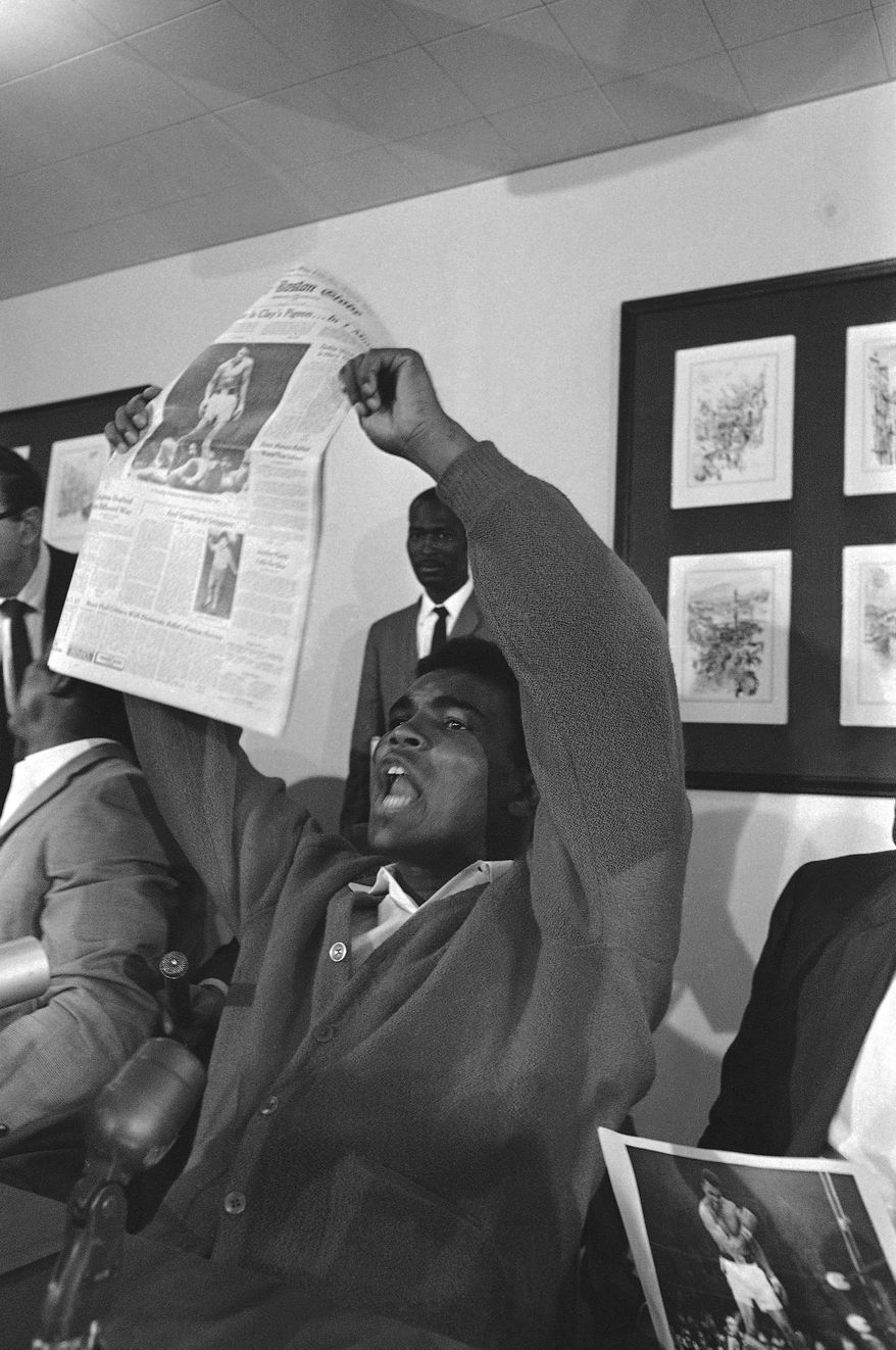 Banner headlines proclaiming his feat occupied the attention of heavyweight champion Muhammad Ali ?Cassius Clay? at his motel at nearby Auburn.   Clay successfully retained crown via a one-round KO over Sonny Liston in Lewiston, Me., on May 26, 1965. (AP Photo)