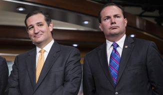 **FILE** Sen. Ted Cruz, R-Texas, left, and Sen. Mike Lee, R-Utah, during a news conference with conservative Congressional Republicans at the Capitol in Washington, Thursday, Sept. 19, 2013. (AP Photo/J. Scott Applewhite)