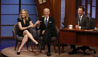 In this photo provided by NBC, from left, actress Amy Poehler and Vice President Joe Biden appear with host Seth Meyers on the premiere of &amp;quot;Late Night with Seth Meyers&amp;quot; on Monday, Feb. 24, 2014, in New York. (AP Photo/NBC, Peter Kramer)