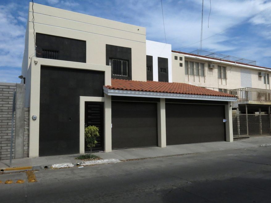 One of the properties that was interconnected by tunnels in the city's drainage system that infamous drug boss Joaquin Guzman Loera, "El Chapo" used to evade authorities is shown, in Culiacan, Mexico, Sunday Feb. 23, 2014. A day after Mexican troops narrowly missed infamous Guzman in Culiacan, one of his top aides was arrested. Officials said he told investigators that he picked up Guzman from a drainage pipe and helped him flee to Mazatlan but a wiretap being monitored by ICE agents in southern Arizona provided the final clue that led to the arrest of one of the world's most wanted men. (AP Photo/Adriana Gomez)