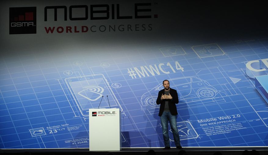 Co-founder and CEO of Whatsapp Jan Koum speaks during a conference at the Mobile World Congress, the world's largest mobile phone trade show in Barcelona, Spain, Monday, Feb. 24, 2014. Expected highlights include major product launches from Samsung and other phone makers, along with a keynote address by Facebook founder and chief executive Mark Zuckerberg. (AP Photo/Manu Fernandez)
