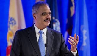 Attorney General Eric Holder speaks at the annual Attorneys General Winter Meeting in Washington, Tuesday, Feb. 25, 2014. Holder said state attorneys general are not obligated to defend laws in their states banning same sex-marriage if they don&#x27;t believe in them.  (AP Photo/Manuel Balce Ceneta)