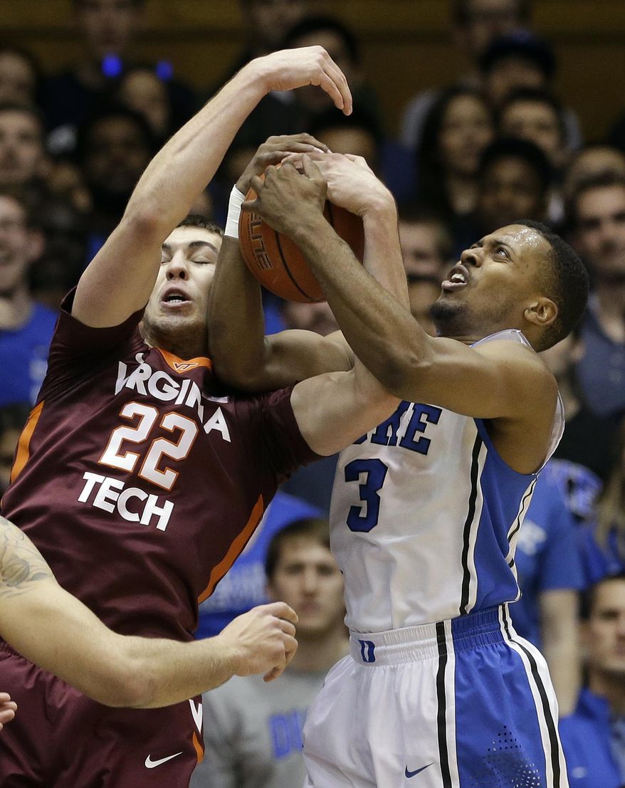 Duke's Tyler Thornton (3) and Virginia Tech's Christian Beyer (22) struggle for a rebound during the first half of an NCAA college basketball game in Durham, N.C., Tuesday, Feb. 25, 2014. (AP Photo/Gerry Broome)