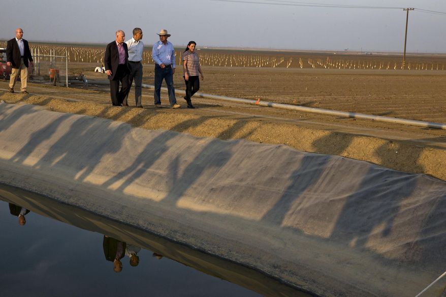 File - In this Feb. 14, 2014, file photo, President Barack Obama tours a local farm that has been affected by drought with Calif. Gov. Jerry Brown, left, Joe Del Bosque, Empresas Del Bosque, Inc., right, and Maria Gloria Del Bosque, Empresas Del Bosque, Inc., in Los Banos, Calif. NASA scientists have begun deploying satellites and other advanced technology to help California water officials assess the state's record drought and better manage it, officials said Tuesday. (AP Photo/Jacquelyn Martin, File)
