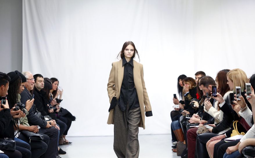 A model wears a creation for South Korean fashion designer Moon Young Hee ready-to-wear fall/winter 2014-2015 fashion collection presented in Paris, Tuesday, Feb.25, 2014. (AP Photo/Jacques Brinon)