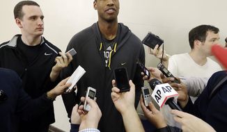 Brooklyn Nets center Jason Collins talks with reporters during  practice on the campus of UCLA in Los Angeles Tuesday, Feb. 25, 2014.  Collins became the first openly gay active athlete in North America&#39;s four major professional sports Sunday, Feb. 23, signing a 10-day contract with the Brooklyn Nets. (AP Photo/Reed Saxon)