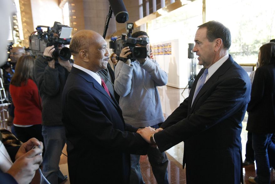 **FILE** Republican presidential hopeful, former Arkansas Gov. Mike Huckabee, says goodbye to Rev. William Owens, president of the Coalition of African American Pastors, after holding an availability announcing the endorsements of various African-American leaders in Atlanta, Monday, Jan. 21, 2008. (AP Photo/Gerald Herbert)