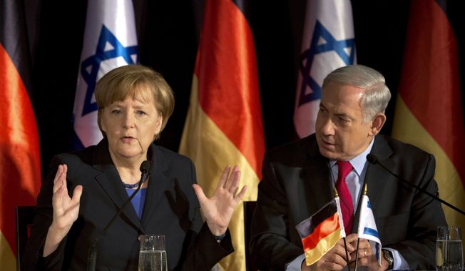 German Chancellor Angela Merkel, left, speaks during joint a press conference with Israeli Prime Minister Benjamin Netanyahu, in Jerusalem, Israel, Tuesday, Feb. 25, 2014. (AP Photo/Oded Balilty)