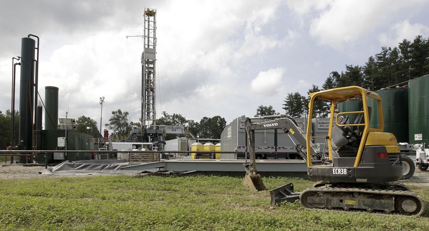 FILE - This Aug. 13, 2013 file photo shows a gas drilling rig at the Detweiler well in Salesville, Ohio. Supreme Court justices in Ohio vigorously challenged attorneys on Wednesday, Feb. 26, 2014 over the power of state-level oil and gas drilling regulations to supersede local zoning laws. (AP Photo/Jay LaPrete, File)