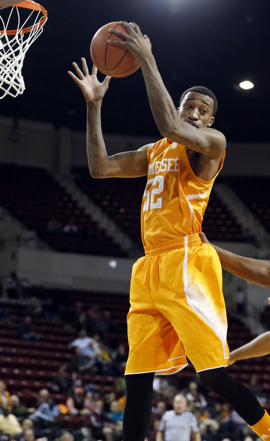 Tennessee guard Jordan McRae (52) hauls in a rebound against Mississippi State in the first half of an NCAA college basketball game in Starkville, Miss., Wednesday, Feb. 26, 2014. (AP Photo/Rogelio V. Solis)