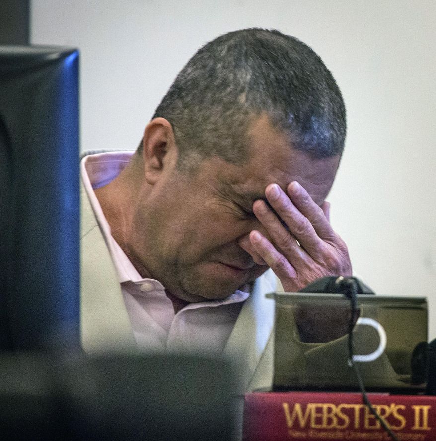 Armando Vergara-Martinez,left, cries while testifying in his own defense in Clark County District Court on Wednesday, Feb. 26, 2014 in Las Vegas. The North Las Vegas man told a jury he was very drunk and doesn't remember hacking his ex-girlfriend's scalp and arms with a machete. Vergara-Martinez was the only defense witness in his attempted murder trial in the March 2012 attack on Maria Del Carmen Gomez. (AP Photo/Las Vegas Review-Journal, Jeff Scheid) LOCAL TV OUT; LOCAL INTERNET OUT; LAS VEGAS SUN OUT