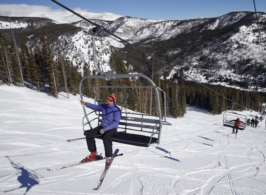 A skier rides the lift on Corona Bowl, known for its extreme skiing, at Eldora Mountain Resort, near Nederland, Colo., Wednesday, Feb. 26, 2014. Lots of new snow and strong winds in the past month have fueled dangerous conditions from the Cascades to the Rockies, prompting forecasters to issue warnings of considerable or high avalanche dangers for many areas outside of established ski areas. (AP Photo/Brennan Linsley)