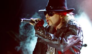 This Dec. 7, 2012 file photo shows Axl Rose, lead vocalist of Guns N&#39; Roses performing during their concert in Bangalore, India. (AP Photo/Aijaz Rahi, file)