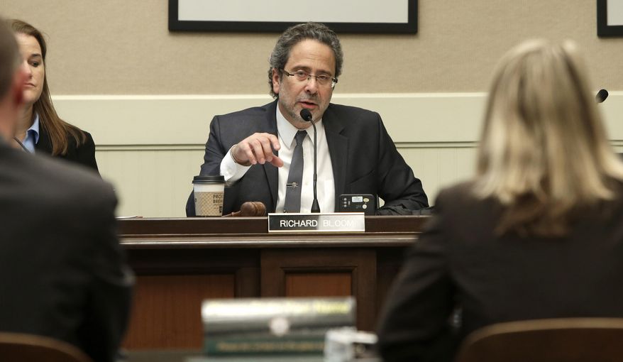 Assemblyman Richard Bloom, D-Santa Monica, chairman of the Assembly Budget Subcommittee No.3 on Resources and Transportation questions Matt Almy, left, and Keely Bosler, of the Department of Finance, about Gov. Jerry Brown's proposed drought-relief package before lawmakers at the Capitol in Sacramento, Calif., Wednesday Feb. 26, 2014. The committee approved the package, which provides $687million that will go toward local water conservation and recycling efforts as well as food assistance in communities hit hardest by the drought. The legislation is expected to be up for a full vote of the Assembly by as early as Thursday.(AP Photo/Rich Pedroncelli)