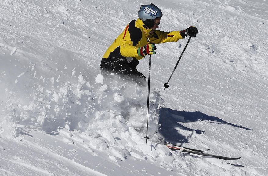 A skier works his way down a steep slope on Corona Bowl, known for its extreme skiing, at Eldora Mountain Resort, near Nederland, Colo., Wednesday, Feb. 26, 2014. Lots of new snow and strong winds in the past month have fueled dangerous conditions from the Cascades to the Rockies, prompting forecasters to issue warnings of considerable or high avalanche dangers for many areas outside of established ski areas. (AP Photo/Brennan Linsley)