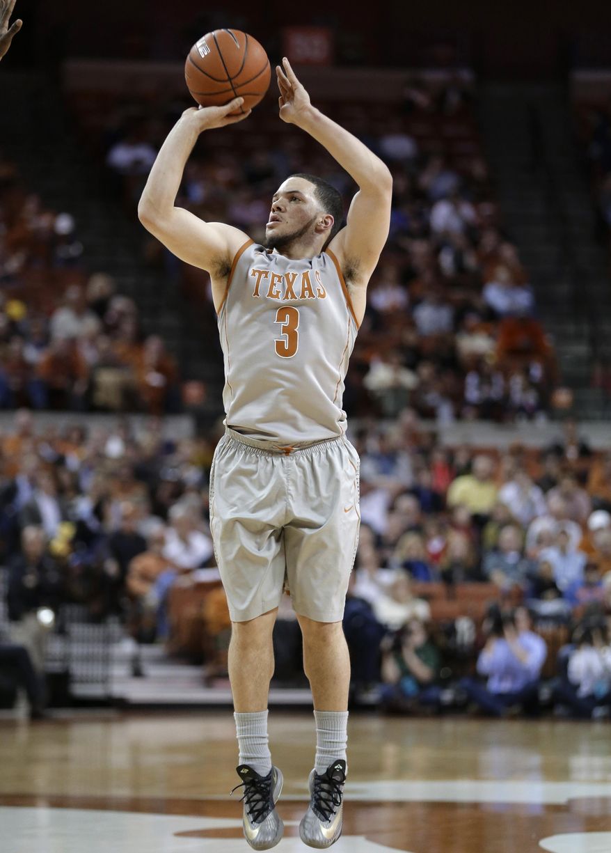 Texas' Javan Felix shoots a 3-pointer against Baylor during the first half of an NCAA college basketball game, Wednesday, Feb. 26, 2014, in Austin, Texas. (AP Photo/Eric Gay)
