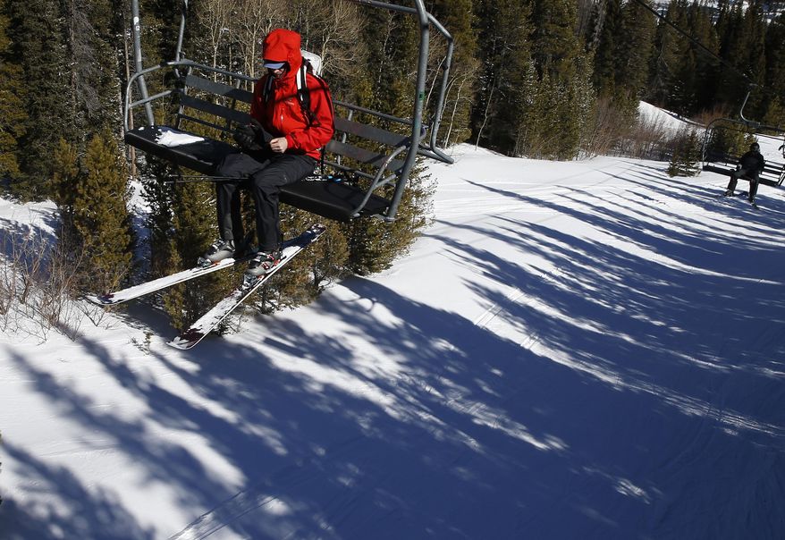 A skier rides the lift on Corona Bowl, known for its extreme skiing, at Eldora Mountain Resort, near Nederland, Colo., Wednesday, Feb. 26, 2014. Lots of new snow and strong winds in the past month have fueled dangerous conditions from the Cascades to the Rockies, prompting forecasters to issue warnings of considerable or high avalanche dangers for many areas outside of established ski areas. (AP Photo/Brennan Linsley)