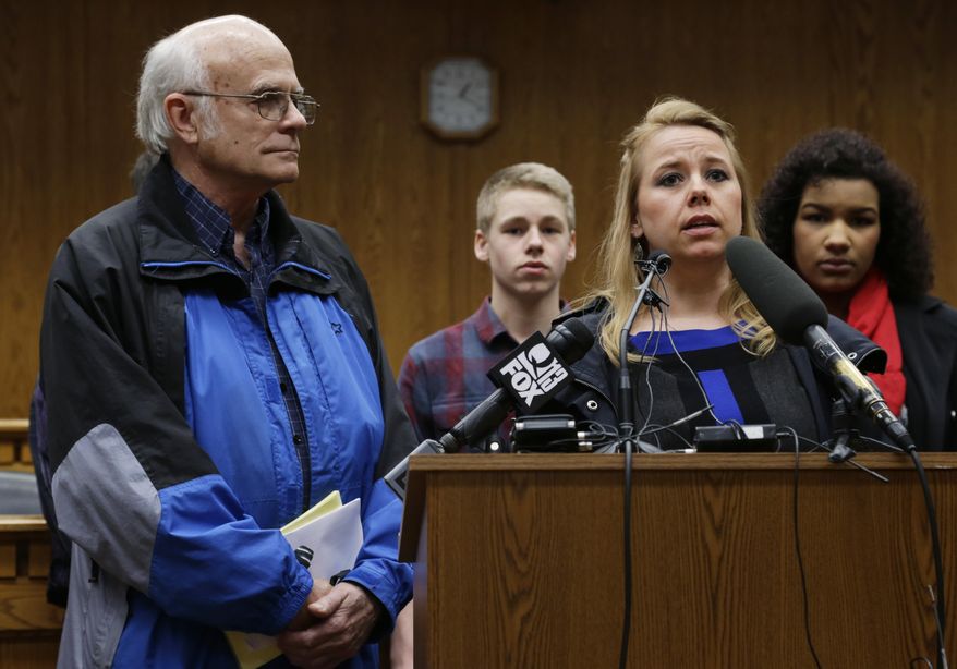 CORRECTS SPELLING OF RIPLEY'S FIRST NAME TO JESSIE INSTEAD OF JESSE - Jim Hungerford, left, stands near his niece, Jessie Ripley, second from right, as she talks about the murder of his sister and Ripley's mother, Jane Hungerford, Wednesday, Feb. 26, 2014, during a news conference at the Capitol in Olympia, Wash. Hungerford was murdered by Cecil Davis, who is currently on death row in Washington state. Family members of murder victims were in Olympia to speak in favor of a measure seeking to prohibit Washington Gov. Jay Inslee from issuing a reprieve if a death penalty case comes to his desk. Earlier in February, Inslee announced a moratorium on executions under his watch. (AP Photo/Ted S. Warren)