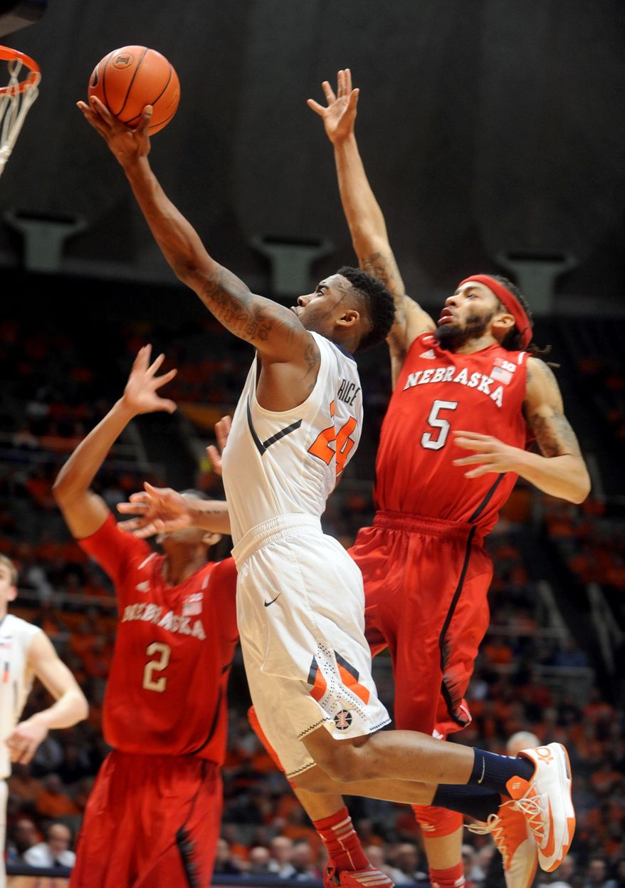 Illinois' Rayvonte Rice (24) goes up for a basket against Nebraska's Terran Petteway (5) during the first half of an NCAA college basketball game Wednesday, Feb. 26, 2014, in Champaign, Ill. (AP Photo/Heather Coit)