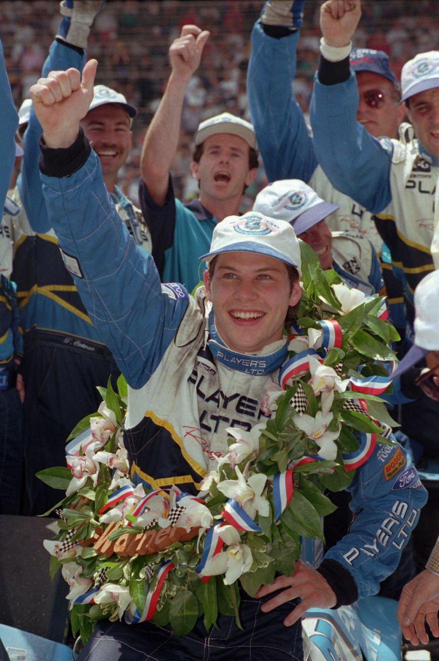 FILE - In this May 28, 1995 file photo, Jacques Villeneuve celebrates in Victory Lane after winning the Indianapolis 500 auto race in Indianapolis. Villeneuve is expected to finally compete for a second Indianapolis 500 crown. On Wednesday, Feb. 26, 2014, the 42-year-old Canadian driver is expected to be announced as a driver for Schmidt Peterson Motorsports this May. (AP Photo/Al Behrman, File)
