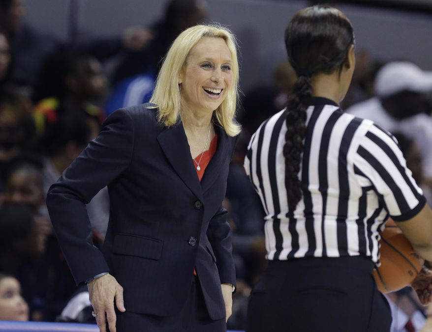 SMU head coach Rhonda Rompolas smiles as she questions a call during the first half of an NCAA college basketball game against Connecticut Tuesday, Feb. 25, 2014, in Dallas. (AP Photo/LM Otero)