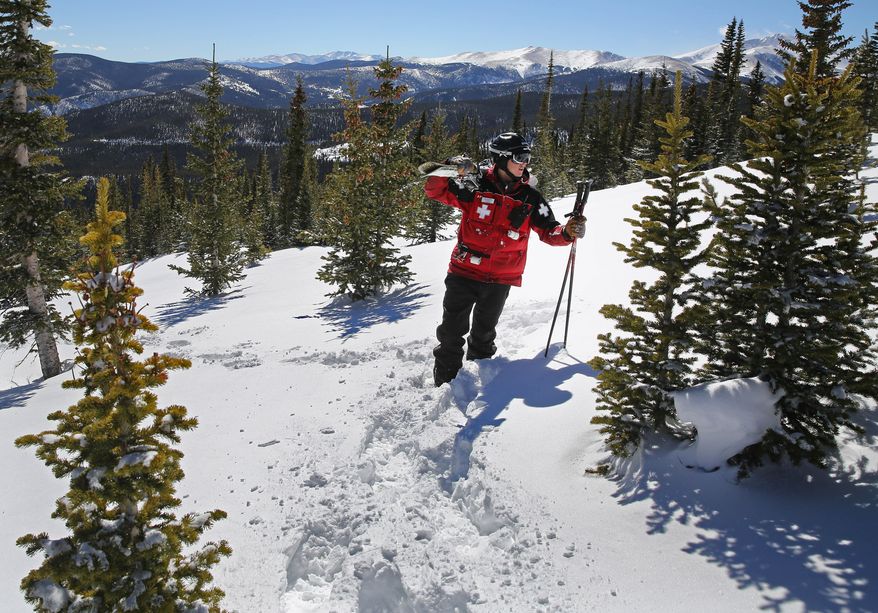 Eldora ski patroller Adam Clifton checks the density of the snow pack in a backcountry area of National Forest land adjacent to Corona Bowl, known for its extreme skiing, at Eldora Mountain Resort, near Nederland, Colo., Wednesday, Feb. 26, 2014. Lots of new snow and strong winds in the past month have fueled dangerous conditions from the Cascades to the Rockies, prompting forecasters to issue warnings of considerable or high avalanche dangers for many areas outside of established ski areas. (AP Photo/Brennan Linsley)