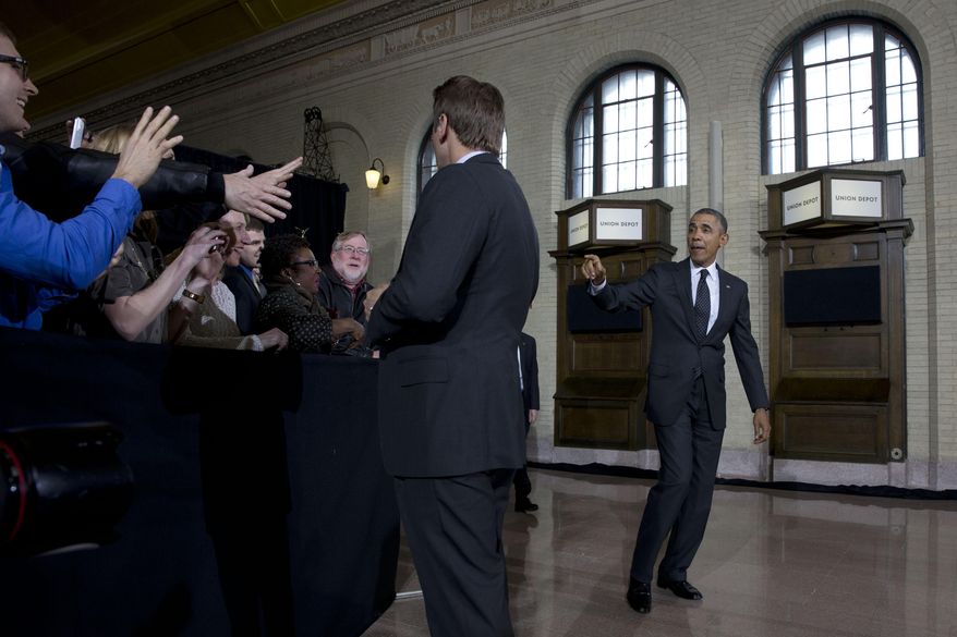 President Barack Obama arrives to speak at Union Depot  in St. Paul, Minn, Wednesday, Feb. 26, 2014, about a $300 billion transportation infrastructure plan. In Minnesota Obama is expected to speak at Union Depot rail and bus station with a proposal asking Congress for $300 billion to update the nation's roads and railways, and about a competition to encourage investments to create jobs and restore infrastructure as part of the President’s Year of Action. (AP Photo/Jacquelyn Martin)