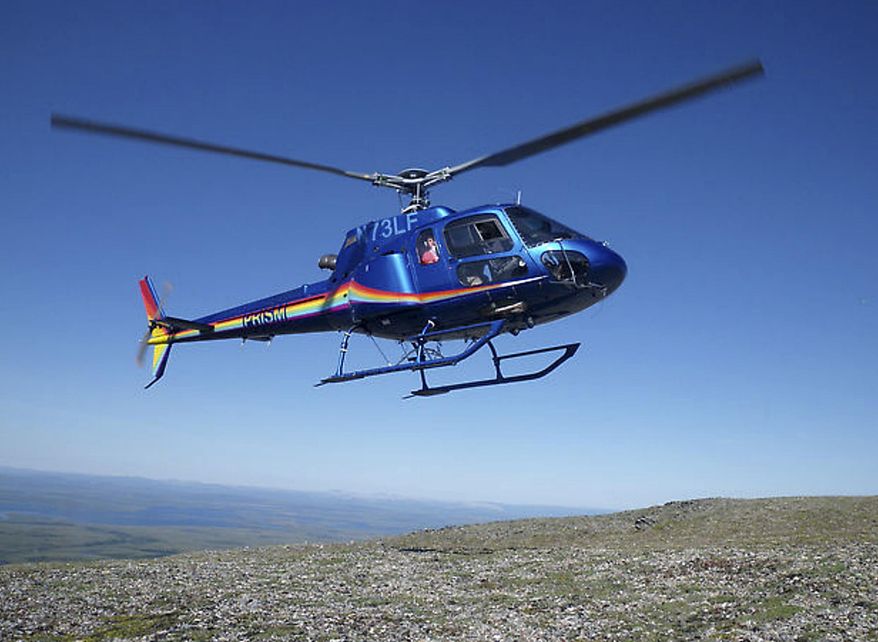 This July 2012 photo released by Graphite One Resources shows a helicopter taking off near Graphite Creek, a mineral claim being explored by Graphite One Resources north of Nome, Alaska. A surge in prices in 2012 and the hope for expanded uses for graphite in electric car batteries has spurred exploration for high-grade flake graphite in North America and around the world. (AP Photo/Graphite One Resources, Dean Besserer)