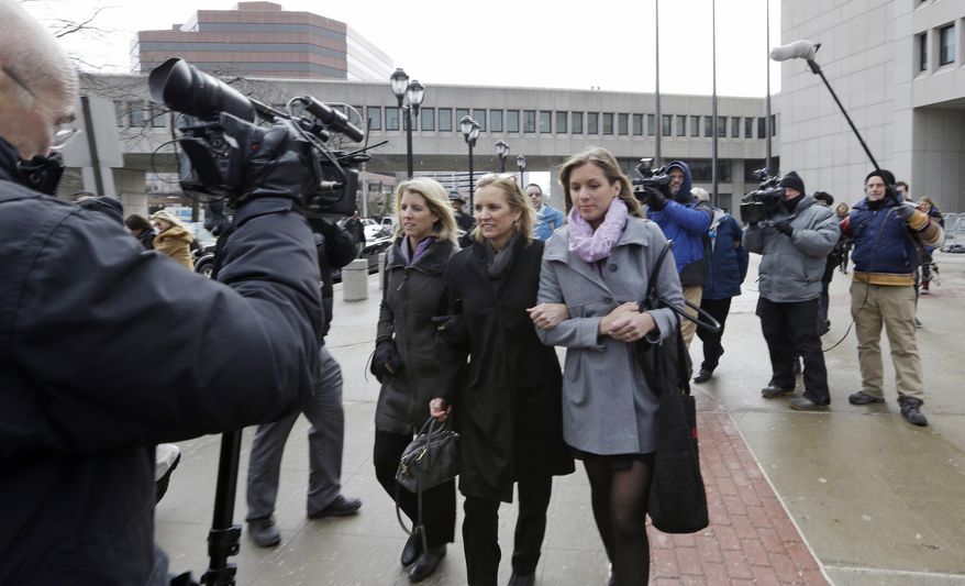 Kerry Kennedy, center, leaves Westchester County courthouse with family members Wednesday, Feb. 26, 2014, in White Plains, N.Y. Kennedy testified Wednesday that she did not knowingly take a sleeping pill on the day her Lexus swerved into a tractor-trailer on a suburban New York highway. (AP Photo/Frank Franklin II)