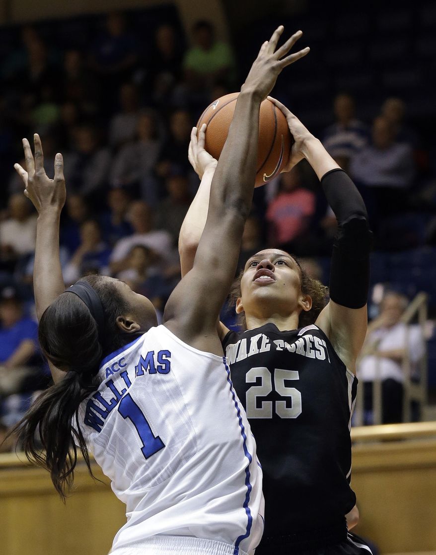 Duke's Elizabeth Williams (1) defends as Wake Forest's Dearica Hamby (25) shoots during the second half of an NCAA college basketball game in Durham, N.C., Thursday, Feb. 27, 2014. Duke won 71-56. (AP Photo/Gerry Broome)
