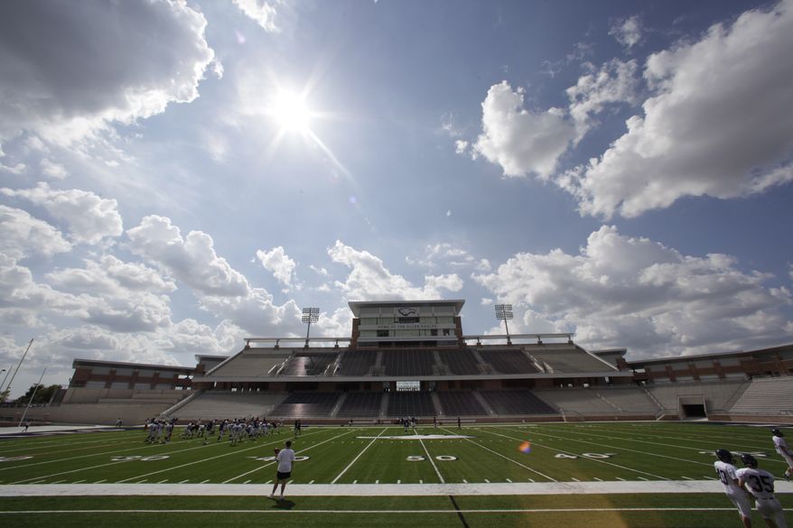 FILE - This Aug. 28, 2012 file photo shows Eagle Stadium at Allen High School in Allen, Texas. The $60 million high school stadium that got national attention for its grandeur _ and its price tag _ will be shut down indefinitely just 18 months after its opening, North Texas school district officials said Thursday, Feb. 27, 2014, for an examination of cracking in the concrete of the stadium's concourse. (AP Photo/LM Otero, File)