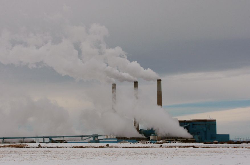 **FILE** Steam rises from the stacks of Basin Electric's Laramie River Station coal-fired power plant near Wheatland, Wyo., on Feb. 11, 2014. (Associated Press/The Casper Star-Tribune, Alan Rogers)