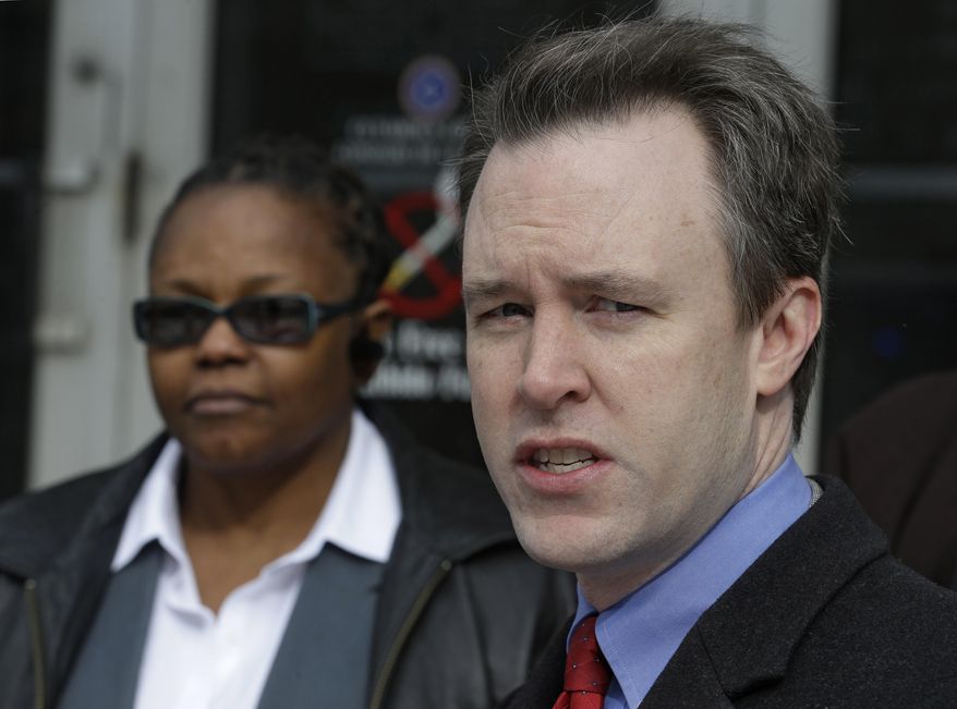 Cuyahoga County Executive Ed FitzGerald, right, speaks about protecting voter rights at a news-conference at the Cuyahoga County Board of Elections Thursday, Feb. 27, 2014, in Cleveland. Ohio's decision Wednesday eliminated early voting on Sundays and only permits it for two Saturdays during the general election. (AP Photo/Tony Dejak)