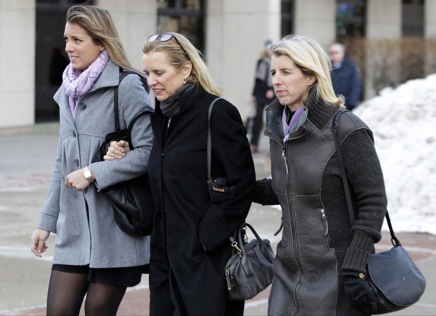 Kerry Kennedy, center, approaches Westchester County courthouse with family members Wednesday, Feb. 26, 2014, in White Plains, N.Y. Kennedy testified Wednesday that she did not knowingly take a sleeping pill on the day her Lexus swerved into a tractor-trailer on a suburban New York highway. (AP Photo/Frank Franklin II)