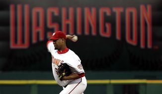 Washington Nationals pitcher Livan Hernandez throws the first pitch of the game against the Arizona Diamondbacks in the Washington Nationals home opener Thursday, April 14, 2005, in Washington. (AP Photo/Evan Vucci)