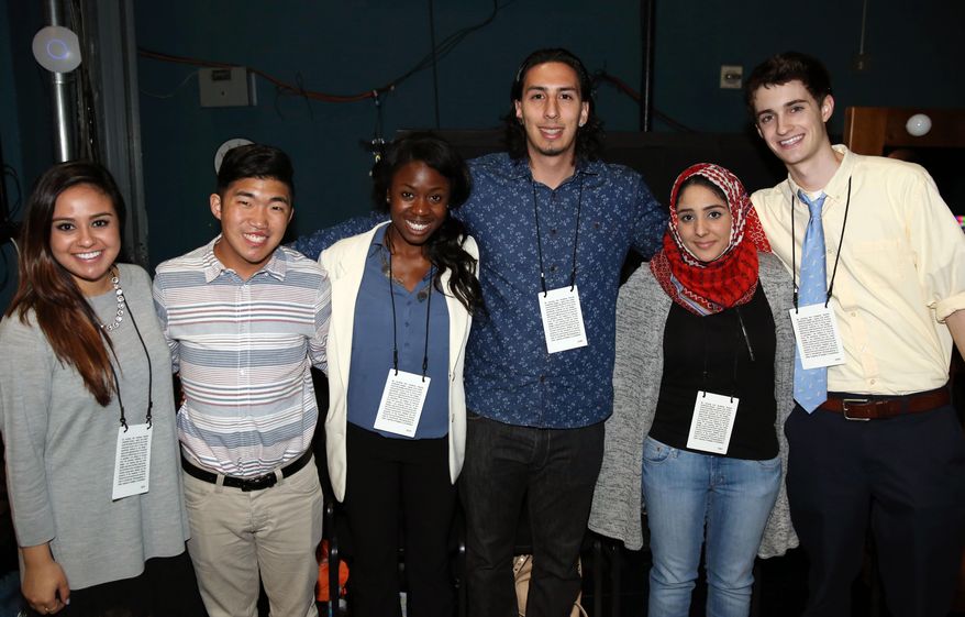 From left, Mackenna Millet, 21, Nathan Flanagan-Frankl, 21, Tayo Amos, 21, Jean Paul Isaacs, 22, Zaineb Abdul-Nabi, 22, and Bryson Kemp, 19, pose together backstage during rehearsals for the 86th Academy Awards in Los Angeles, Wednesday, Feb. 26, 2014. These six aspiring young filmmakers were selected from colleges across the country and will be handing Oscar statuettes to the stars presenting them Sunday, March 2, 2014. (Photo by Matt Sayles/Invision/AP)