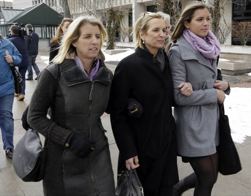 Kerry Kennedy, center, leaves Westchester County courthouse accompanied by family members Wednesday, Feb. 26, 2014, in White Plains, N.Y. Kennedy testified Wednesday that she did not knowingly take a sleeping pill on the day her Lexus swerved into a tractor-trailer on a suburban New York highway. (AP Photo/Frank Franklin II)