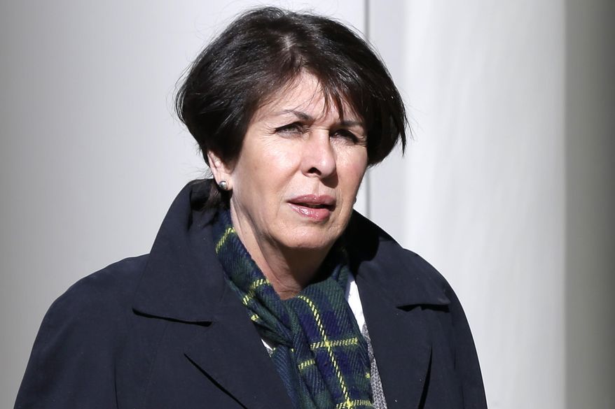 Former Arkansas treasurer Martha Shoffner walks to the federal courthouse in Little Rock, Ark., for arraignment on charges that she misspent thousands of dollars in campaign money on personal items.Thursday, Feb. 27, 2014. (AP Photo/Danny Johnston)